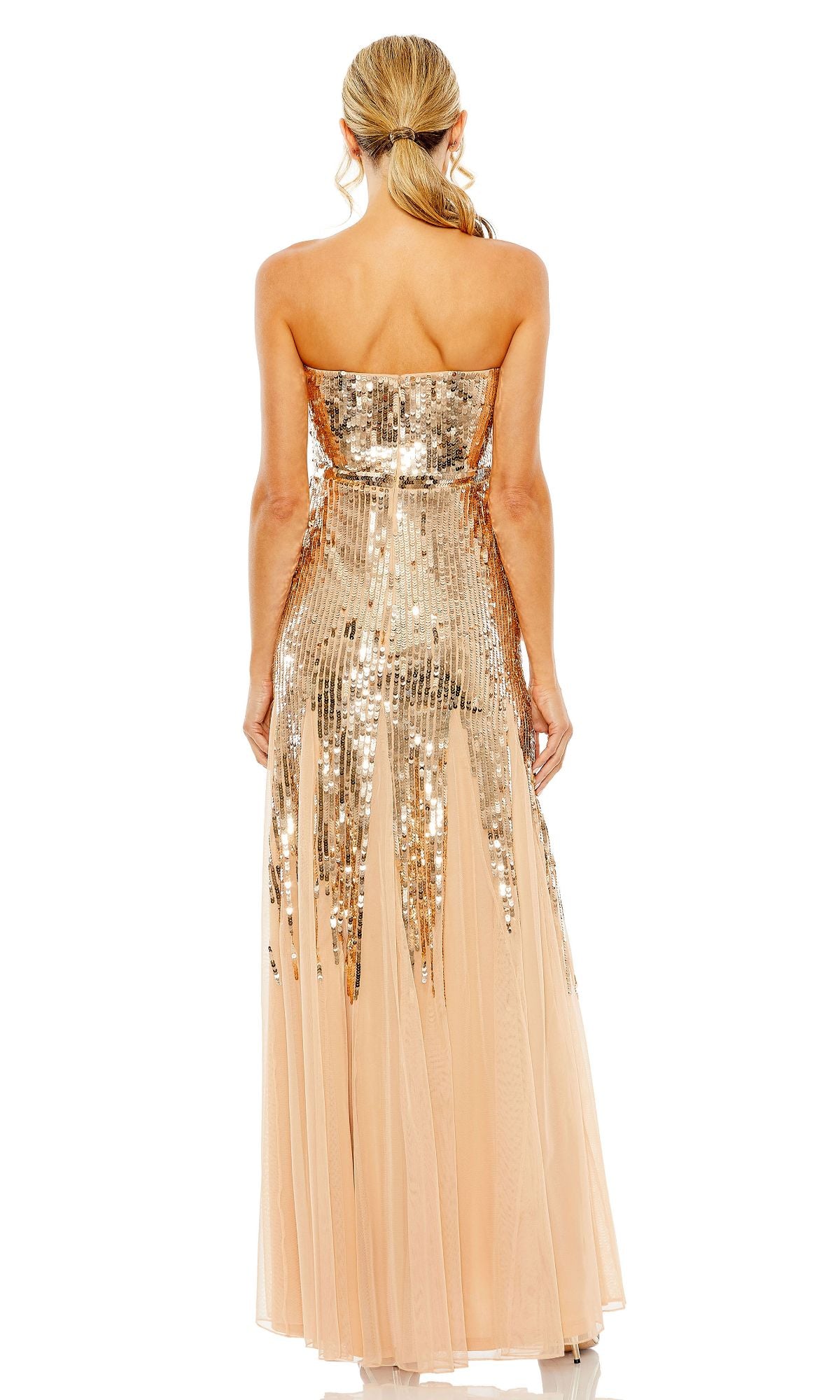 A woman with a ponytail models the Mac Duggal 93959 strapless sequin formal dress, featuring gold sequins and a sheer peach skirt, shown elegantly from the back against a white background.